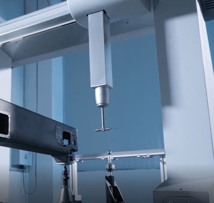 Coordinate measuring machine probe inspecting a component