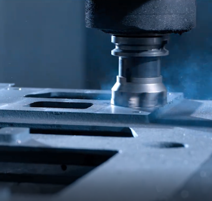 Machining center spindle cutting a metal component